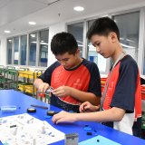 students building a car