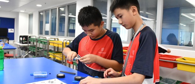 students building a car