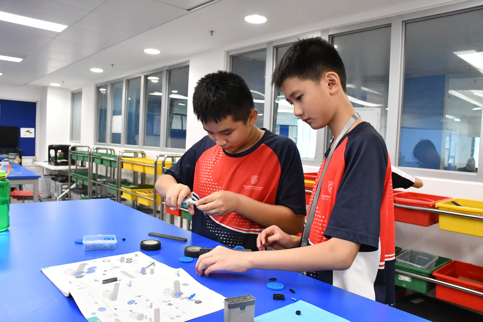 students building a car