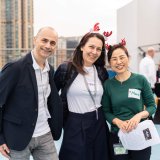 three staff members smiling