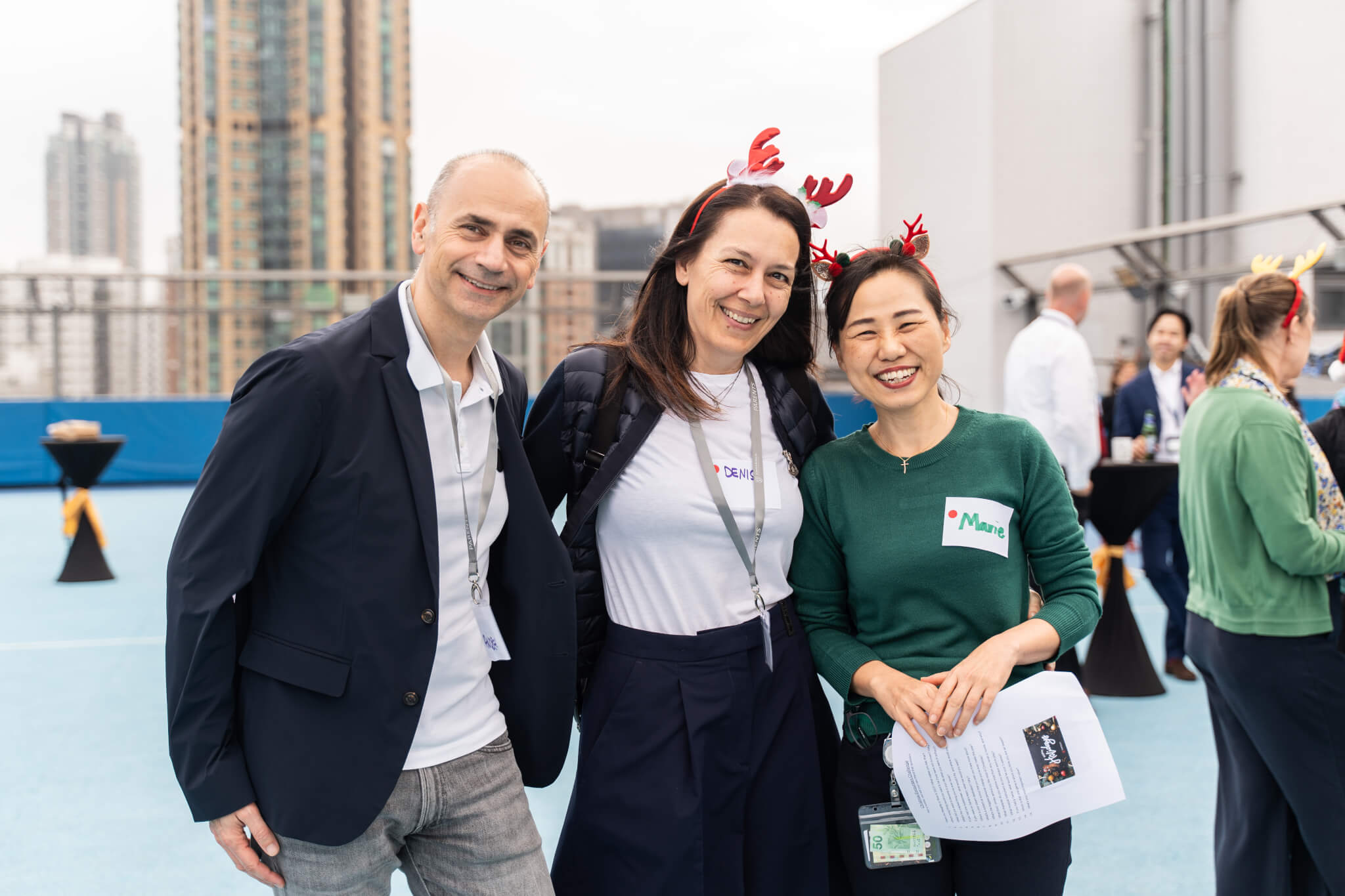 three staff members smiling