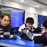 children working in a robotics class